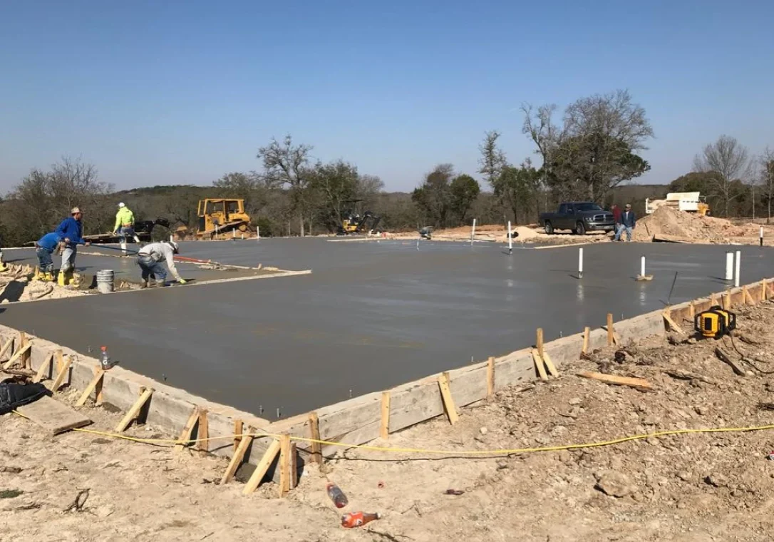 Workers building a concrete slab
